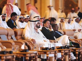 Pakistani Prime Minister Imran Khan, ,centre right sits next to United Arab Emirates Prime Minister Sheikh Mohammad bin Rashed, as they attend the opening of the Future Investment Initiative conference, in Riyadh, Saudi Arabia, Tuesday, Oct. 23, 2018. Saudi Arabia is moving ahead with plans to hold the glitzy investment forum, despite some of its most important speakers pulling out in the global outcry over the killing of Saudi journalist Jamal Khashoggi.