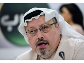 FILE - In this Feb. 1, 2015 file photo, Saudi journalist Jamal Khashoggi speaks during a news conference in Manama, Bahrain. Saudi Arabia is moving ahead with plans to hold a glitzy investment forum that kicks off Tuesday, Oct. 23, 2018, despite some of its most important speakers pulling out in the global outcry over the killing of Khashoggi. The meeting was intended to draw leading investors who could help underwrite Crown Prince Mohammed bin Salman's ambitious plans to revamp the economy.