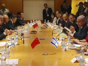 Israeli Prime Minister Benjamin Netanyahu, right, and China's Vice President Wang Qishan sit during their meeting in Jerusalem, Wednesday, Oct. 24, 2018.