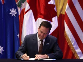 Australia's Trade Minister Steven Ciobo signs the rebranded 11-nation Pacific trade pact Comprehensive and Progressive Agreement for Trans-Pacific Partnership (CPTPP) in Santiago, on March 8, 2018.