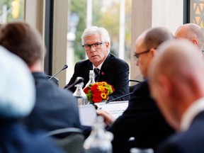 International Trade Minister Jim Carr sits with his counterparts at the WTO reform meeting in Ottawa.