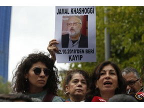 Activists, members of the Human Rights Association Istanbul branch, holding posters with photos of missing Saudi journalist Jamal Khashoggi, talk to members of the media, during a protest in his support near the Saudi Arabia consulate in Istanbul, Tuesday, Oct. 9, 2018. The poster reads in Turkish: ' Jamal Khashoggi, missing since October 2, 2018'. Khashoggi disappeared after entering Saudi Arabia's consulate to obtain paperwork required for his marriage to his Turkish fiancee. Turkish officials have alleged he was killed in the compound while Saudis officials said he left the building unharmed.