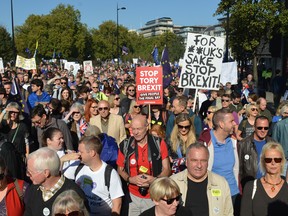 Thousands of people march in London to demand a vote on the final Brexit deal.