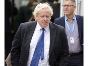 Conservative MP Boris Johnson arrives at the Conservative Party Conference at the ICC, in Birmingham, England, Tuesday Oct. 2, 2018. He's not a member of the government and he's not speaking on the main stage, but Boris Johnson is a star at Britain's Conservative Party conference.