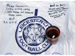 Tributes are placed outside Leicester City Football Club, Leicester, England, Monday Oct. 29, 2018, after a helicopter crashed in flames Saturday. Vichai Srivaddhanaprabha, the Thai billionaire owner of Premier League team Leicester City was among five people who died after his helicopter crashed and burst into flames shortly after taking off from the soccer field, the club said Sunday.