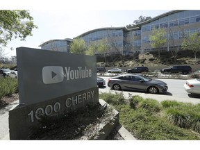FILE - In this Tuesday, April 3, 2018 file, a YouTube sign is shown across the street from the company's offices in San Bruno, Calif. YouTube's video streaming service went out for more than an hour on Tuesday, Oct. 16, 2018, apparently affecting locations around the world. YouTube acknowledged the outage in a tweet at 9:41 p.m. EDT, noting that it affected YouTube, YouTube Music and YouTube TV.