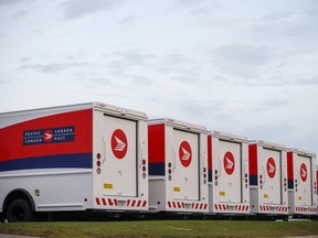 Canada Post Corp. mail delivery trucks sit in the Gateway Postal Facility parking lot during a Canadian Union of Postal Workers (CUPW) strike in Toronto, Ontario, Canada, on Tuesday, Oct. 23, 2018.