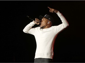 FILE - In this Nov. 1, 2018 file photo, Chance The Rapper performs during a community concert at the Obama Foundation Summit in Chicago. Chance the Rapper is so serious about raising money for arts education programs in Chicago that he took a second job: Lyft driver. The Chicago-born Grammy-winning hip-hop artist who's given millions of dollars to the school district recently went undercover as a Lyft driver to make a video that encourages riders to donate to the arts programs in the city's public schools.