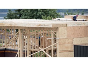 A new home is under construction in North Vancouver, B.C., Tuesday, June 12, 2018. The annual pace of Canadian housing starts in September slowed compared with August.