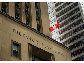 The Bank of Nova Scotia building is shown in the financial district in Toronto on Tuesday, August 22, 2017. Scotiabank says Benita Warmbold, a former chief financial officer of the Canada Pension Plan Investment Board, has joined the bank's board of directors. Warmbold retired from CPPIB in June 2017.