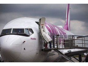 Swoop Airlines Boeing 737 on display during their media event, Tuesday, June 19, 2018 at John C. Munro International Airport in Hamilton, Ont. Swoop is resuming all scheduled flights to the U.S. after receiving its final operating approval.