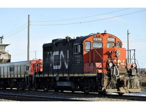 A CN locomotive makes it's way through the CN Taschereau yard in Montreal, Saturday, Nov., 28, 2009. Canadian National Railway Co. has signed a deal to acquire Winnipeg-based the TransX Group of Companies. Financial terms of the deal for the trucking company were not disclosed.