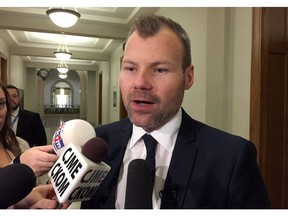 Saskatchewan Energy Minister Dustin Duncan talks with reporters at the provincial legislature, in Regina on Thursday, Nov. 17, 2016. Saskatchewan will have to wait until next spring for the province's Appeal Court to rule on whether Ottawa can impose a carbon tax.THE CANADIAN PRESS/Jennifer Graham