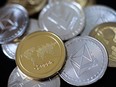Litecoin, ripple and ethereum cryptocurrency coins.