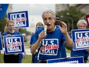 American Postal Workers Union president Mark Dimondstein speaks at a rally to oppose a plan by the White House's Office of Management and Budget to sell off the U.S. Postal Service to corporate interests, at Freedom Plaza, Monday, Oct. 8, 2018, in Washington.