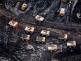 Heavy haulers at the Suncor Energy Inc. Fort Hills mine. Canada’s largest oil companies begin reporting third quarter earnings on Thursday.