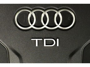 FILE - The Sept. 28, 2015 file photo shows the sign of German car company Audi attached on the engine of a TDI, a turbo diesel model, in Berlin, Germany. Audi accepted a fine of 800 million euro (927 million US$) for it's involvement in the Diesel scandal.