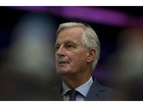EU chief Brexit negotiator Michel Barnier talks to other European Commissioners before a weekly meeting at the European Commission headquarters in Brussels, Wednesday, Oct. 17, 2018. European Union leaders are converging on Brussels for what had been billed as a "moment of truth" Brexit summit.