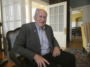 In this photo taken Sunday, Sept. 23, 2018, Alaska Gov. Bill Walker poses in the governor's mansion following an interview in Juneau, Alaska. Walker, an independent who is seeking re-election, has faced some criticism for his decision to reduce the size of the check that Alaskans receive from the state's oil-wealth fund while the state was in the midst of a budget deficit.