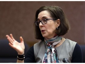 FILE - In this Thursday, Jan. 26, 2017, file photo, Oregon Gov. Kate Brown speaks to media representatives in Salem, Ore. Oregon Gov. Kate Brown has issued an executive order blocking offshore drilling. The Democrat's order Thursday, Oct. 25, 2018, means Oregon joins several other states trying to shield themselves from the Trump administration's plan to drill for oil and gas off the U.S. coast.