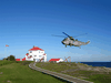 The main way to travel to lighthouses in B.C. is either by boat or helicopter. Here a chopper lands at Entrance Island.