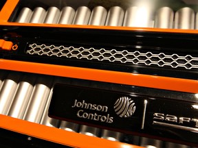 Johnson Controls logo appears on an array of lithium-ion batteries in 2008. Brookfield Asset Management is nearing a deal to buy Johnson Controls’ auto-battery business, sources say.