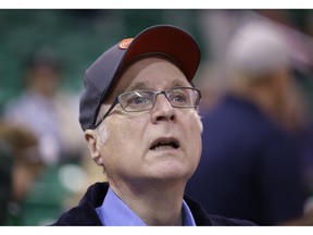 FILE - In this Oct. 12, 2015 file photo, Portland Trail Blazers owner Paul Allen looks on before the start of the first quarter of an NBA preseason basketball game against the Utah Jazz in Salt Lake City. Allen, billionaire owner of the Trail Blazers and the Seattle Seahawks and Microsoft co-founder, says cancer he was treated for in 2009 has returned. Allen made the announcement Monday, Oct. 1, 2018 on Twitter, saying he recently learned of the non-Hodgkin's lymphoma and that his team of doctors has started treatment.