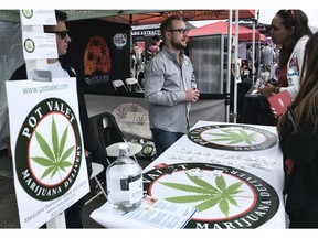 FILE - This March 31, 2018 photo shows a booth advertising a delivery service for cannabis at the Four Twenty Games in Santa Monica, Calif. California is moving a step closer to allowing marijuana deliveries in communities that have banned retail sales. Regulators on Friday, Oct. 19, 2018, announced preliminary approval of the proposed rule over objections from cities and police chiefs who say the policy will lead to crime.