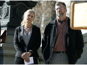 FILE - In this Feb. 19, 2015 file photo Hope, left, and Mike Reilly of Pueblo, Colo., attend a news conference in reaction to the announcement that a federal lawsuit is being filed on behalf of the couple by a Washington D.C.-based group to shut down the state's $800-million-a-year marijuana industry, in Denver. A federal trial in Colorado on Monday, Oct. 29, 2018, could have far-reaching effects on the budding U.S. marijuana industry if a jury sides with the couple who say having a cannabis business as a neighbor hurts their property's value.