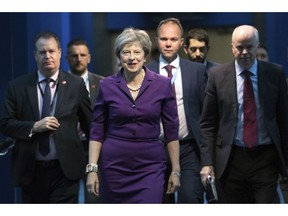 Britain's Prime Minister Theresa May arrives at the Conservative Party annual conference at the International Convention Centre, Birmingham, central England, Tuesday Oct. 2, 2018.