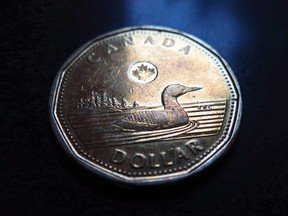 A Canadian dollar or loonie.