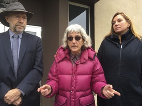 Defendant Annette Klapstein, center, speaks outside Clearwater County courthouse in Bagley, Minn., after she was acquitted along with two other defendants on Tuesday, Oct. 9, 2018.