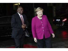 German Chancellor Angela Merkel, right, welcomes the President of South Africa Cyril Ramaphosa, left, for a meeting at the chancellery in Berlin, Germany, Monday, Oct. 29, 2018.