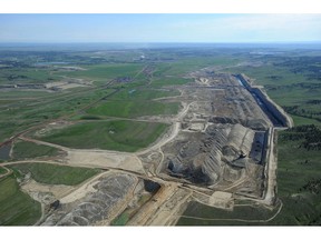 FILE - This file photo taken May 25, 2013, shows an aerial view of Colstrip power plants 1,2,3 & 4 and the Westmoreland coal mines near Colstrip, Mont. Westmoreland Coal Co. of Englewood, Colo., filed for bankruptcy Tuesday, Oct. 9, 2018, to deal with steep debt and declining world demand. Company officials say the Chapter 11 filing is part of a restructuring agreement with an unnamed group of lenders. Company officials say operations won't be interrupted and there are no expected staff reductions. Westmoreland has coal mines in Montana, Wyoming, New Mexico, Ohio, North Dakota and Texas and a coal-fired power plant in North Carolina.