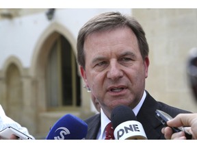 ExxonMobil Senior Vice President Neil Chapman speaks to the media after a meeting with Cyprus' president Nicos Anastasiades at the presidential palace in capital Nicosia, Cyprus, Friday Oct. 5, 2018.  Chapman says the energy company will go ahead with a search for natural gas off the cost of Cyprus by the end of the year.