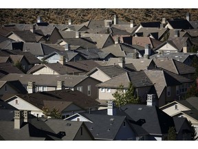 In this Oct. 12, 2018, photo, homes fill a small a valley on the outskirts of Reno, Nev. Silicon Valley firms from Apple to Tesla have set up operations in the Reno area, bringing waves of well-paid tech and manufacturing workers which in turn helps to raise home prices and rents.
