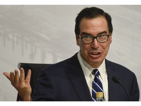 ILE - In this July 22, 2018 file photo, U.S. Treasury Secretary Steven Mnuchin speaks during a news conference at the G20 meeting of Finance Ministers and Central Bank governors in Buenos Aires, Argentina.  The Treasury Department has issued new rules on foreign investments into American companies that will give the government more power to block foreign transactions on national security grounds. The rules represent the latest escalation in an intensifying economic conflict between the United States and China.