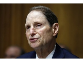 FILE - In this June 28, 2018, file photo, Sen. Ron Wyden, D-Ore., ranking member of the Senate Finance Committee, speaks during a hearing on the nomination of Charles Rettig for Internal Revenue Service Commissioner on Capitol Hill in Washington. Low-income people in states that haven't expanded Medicaid are much more likely to forgo needed medical care than the poor in other states, according to a government report due out Monday, Oct. 15, amid election debates from Georgia to Utah over coverage for the needy. "States around the country have an opportunity to expand Medicaid to more people; these findings help show why it's a winning proposition for states and the millions of Americans currently left out," said Wyden, who requested the analysis.