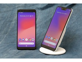FILE- This Wednesday, Oct. 10, 2018, file photo shows the Google Pixel 3, left, and Google Pixel 3 XL, and wireless charging stand in New York. Google's new Pixel 3 phone plays catch-up with Apple and Samsung on hardware. It's really designed to showcase Google's advances in software, particularly in artificial intelligence.
