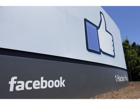 FILE - This July 16, 2013 file photo shows a sign at Facebook headquarters in Menlo Park, Calif. Facebook Inc. reports earnings Tuesday, Oct. 30, 2018.