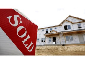 FILE- In this June 27, 2018, file photo, a sold sign stands in front of a home under construction in West Des Moines, Iowa. On Wednesday, Oct. 24, the Commerce Department reports on sales of new homes in September.