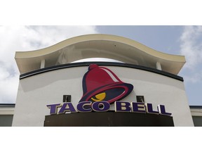 FILE- This Aug. 3, 2017, file photo shows a Taco Bell sign at a restaurant in Hialeah, Fla. Yum Brands, Inc., which operates Taco Bell, KFC and Pizza Hut reports earnings Wednesday, Oct. 31, 2018.
