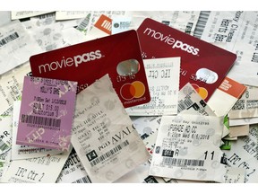 FILE- This Aug. 23, 2018, file photo shows Movie Pass debit cards and used movie tickets in New York. The company that runs the beleaguered MoviePass, a discount service for movie tickets at theaters, is being investigated by the New York Attorney General on allegations it misled investors.