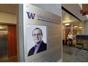 FILE- In this Monday, Oct. 15, 2018, file photo a portrait of Paul Allen stands on a wall at the Paul G. Allen School of Computer Science & Engineering at the University of Washington in Seattle. Prior to his death on Monday, Allen invested large sums in technology ventures, research projects and philanthropies, some of them eclectic and highly speculative. Outside of bland assurances from his investment company, no one seems quite sure what happens now.