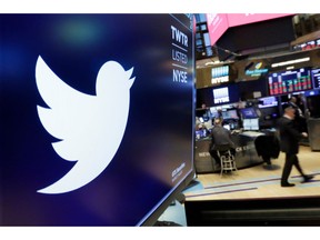 FILE - In this Feb. 8, 2018, file photo, the logo for Twitter is displayed above a trading post on the floor of the New York Stock Exchange. Twitter reports earnings Thursday, Oct. 25.