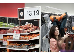 FILE- In this Oct. 3, 2018, file photo Sophia Narvaez, looks at Halloween decorations at a Target department store in Pembroke Pines, Fla. On Thursday, Oct. 11, the Labor Department reports on U.S. consumer prices for September.