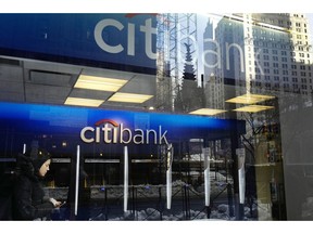 FILE - In this March 16, 2017, file photo, a customer enters a Citibank branch, in New York. Citigroup reports earnings Friday, Oct. 12, 2018.