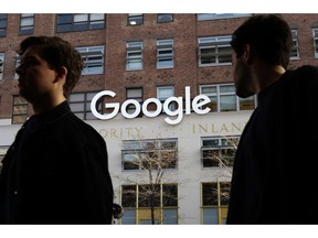 FILE - In this Dec. 4, 2017 file photo, people walk by Google offices in New York. Google is closing the consumer version of its long-spurned Plus social network after discovering a bug earlier this year that leaked some of the personal information about up to 500,000 people who still have accounts on the dying service.