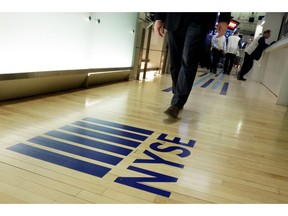 FILE- In this April 5, 2018, file photo a NYSE logo adorns the entrance to the trading floor the New York Stock Exchange. The U.S. stock market opens at 9:30 a.m. EDT on Thursday, Oct. 11.