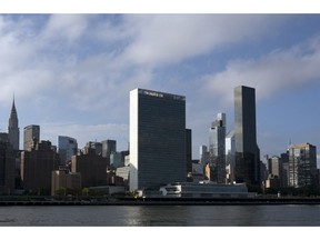 In this Oct. 10, 2018 photo, Trump World Tower, right, rises above the United Nations headquarters, center, in New York. Donald Trump's business ties to Saudi Arabia run long and deep, and he's often boasted about his business ties with the kingdom. Now those ties are under scrutiny as the president faces calls for a tougher response to the kingdom's government following the disappearance, and possible killing, of one of its biggest critics, journalist and activist Jamal Khashoggi. Trump said Friday that he will soon speak with Saudi Arabia's king about Khashoggi's disappearance.